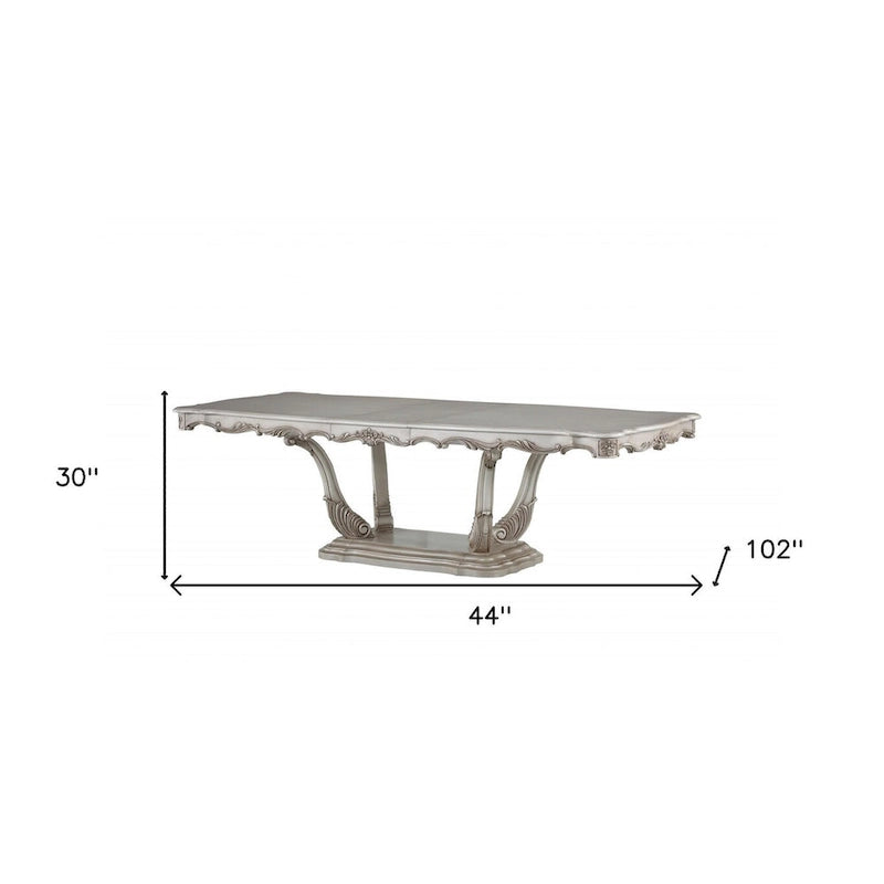 Table de salle à manger classique à piédestal rectangulaire en bois massif blanc cassé orné